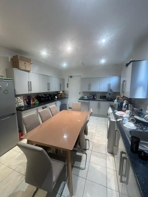 Bright, modern kitchen with ample cabinetry, a ...