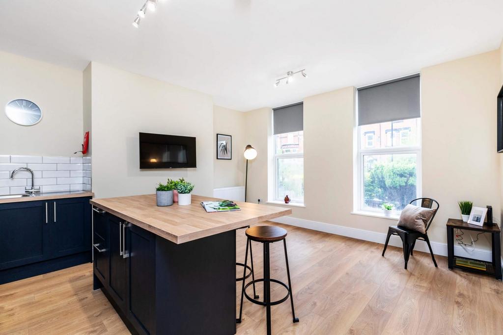 Bright open-plan living area with large windows...