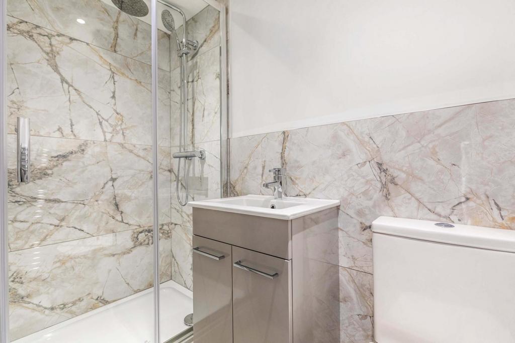 Modern bathroom with a walk-in shower, contempo...