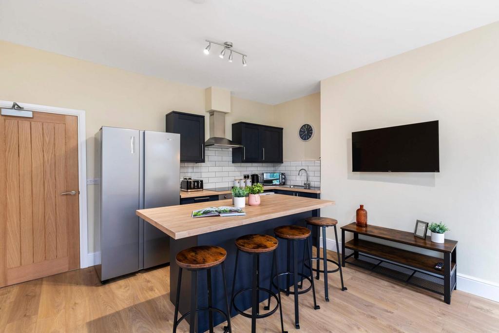 Contemporary open kitchen with a central island...