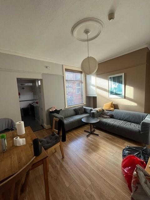 Bright, modern living room with two grey sofas ...