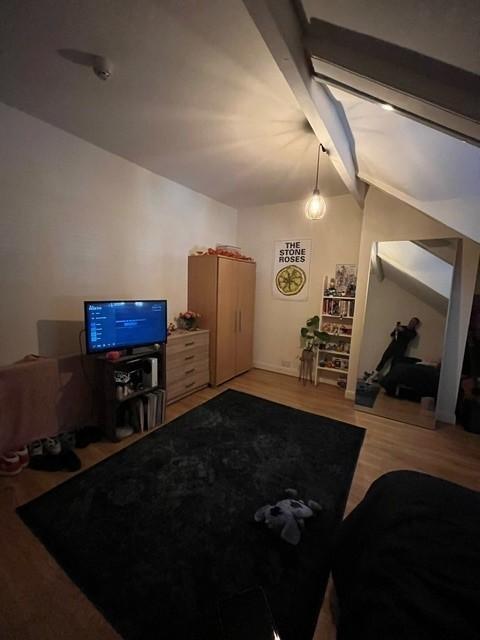 Cozy attic double bedroom with sloped ceiling, ...