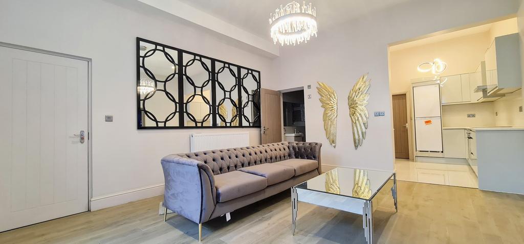 Bright, modern living area with stylish sofa, d...