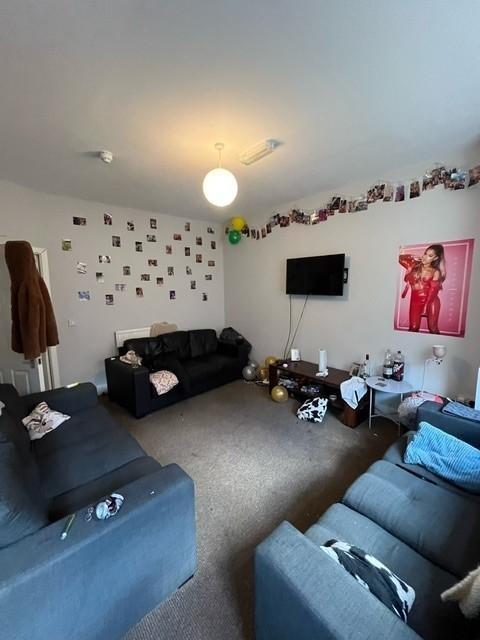 Bright, comfortable communal lounge with multip...