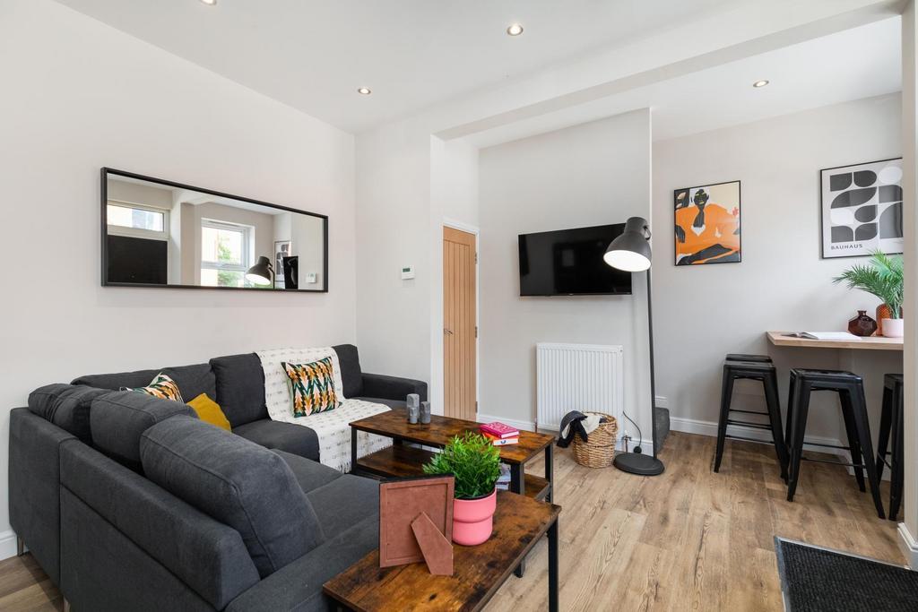 Bright contemporary living room with a charcoal...