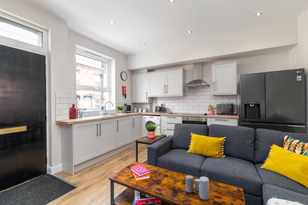 Bright open-plan living area with a modern fitt...