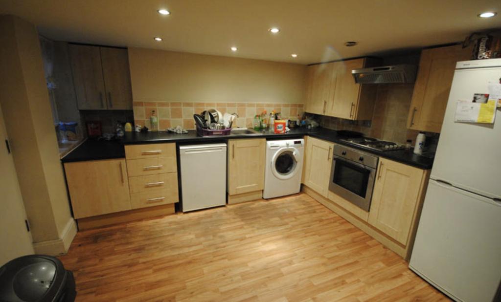 Modern fitted kitchen with a full set of applia...