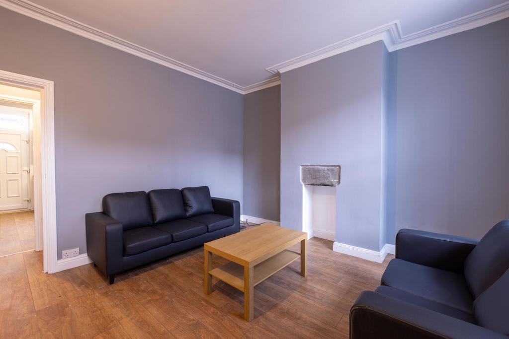 Bright, neutral living room with modern seating...