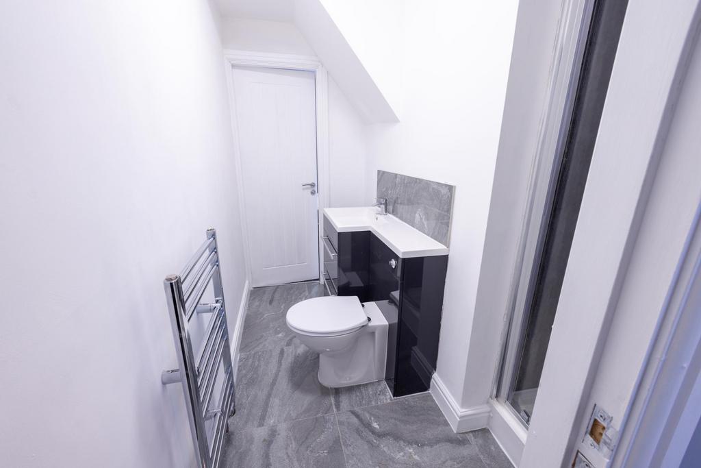 Bright modern bathroom with contemporary grey t...
