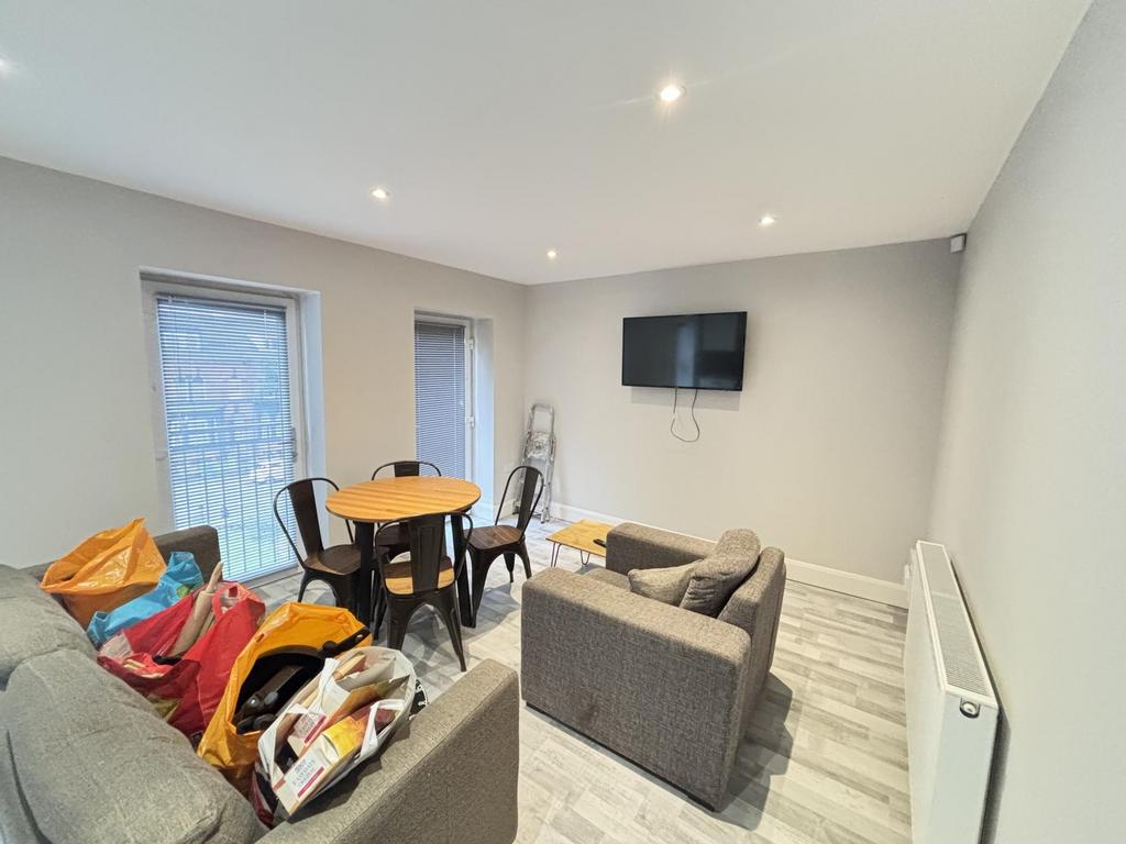 Bright, modern living area with neutral decor, ...