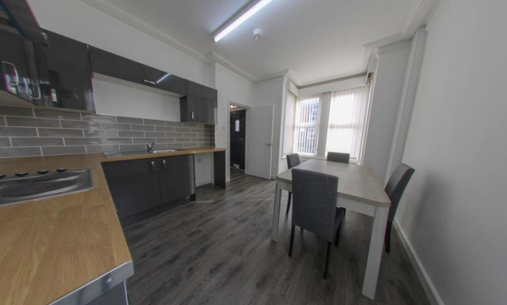 Bright modern kitchen-diner with fitted cupboar...
