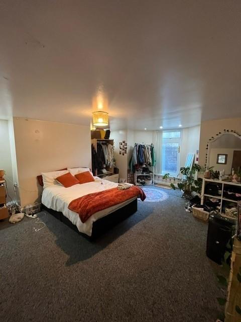 Spacious, well-styled bedroom with a double bed...