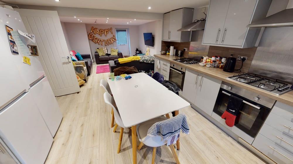 Open-plan living space with a modern fitted kit...