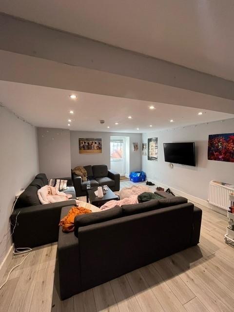 Contemporary communal living room with multiple...