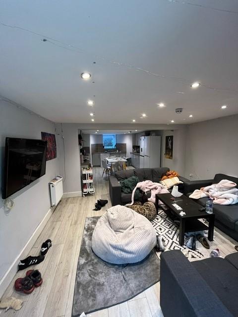 Spacious open-plan living area with contemporar...