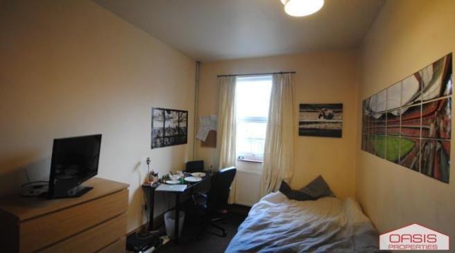 Cozy furnished bedroom with a comfortable bed, ...