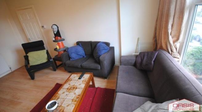Bright, comfortable living room with a large L-...