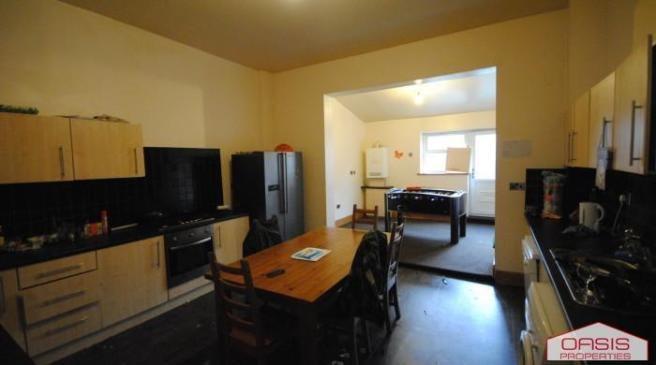 Spacious, modern kitchen with ample cabinetry, ...