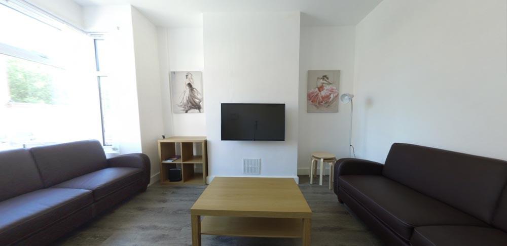 Bright, contemporary living room with matching ...