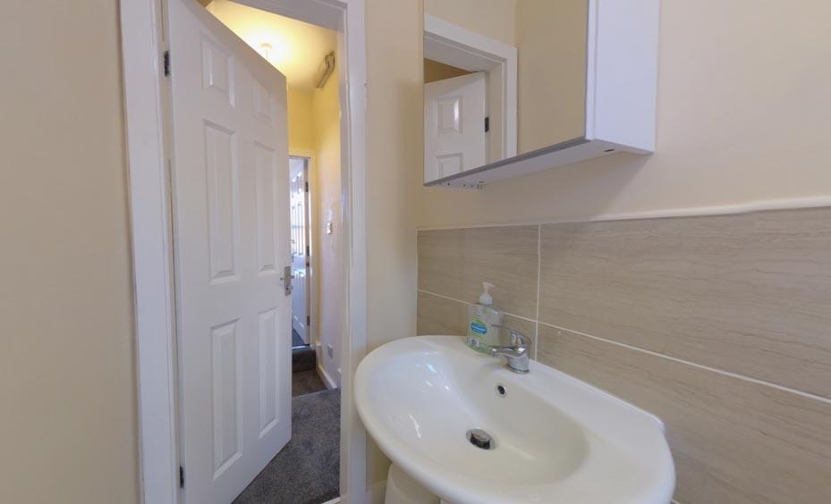 Clean, well-maintained bathroom sink area with ...