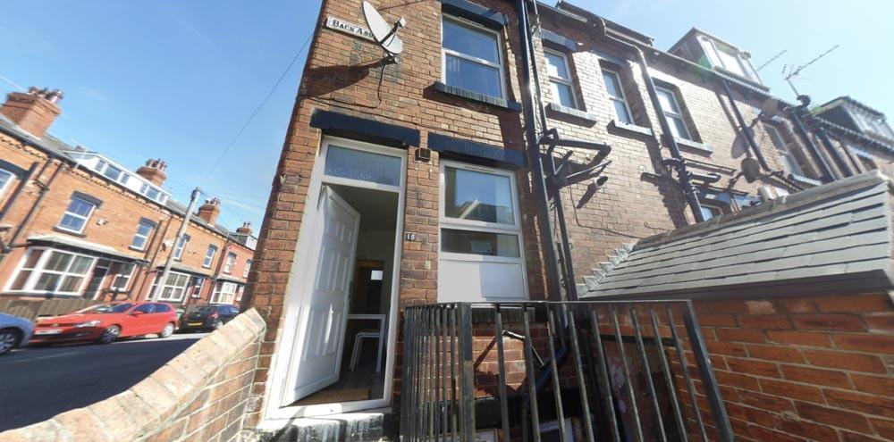 Street-facing view of a brick terraced property...