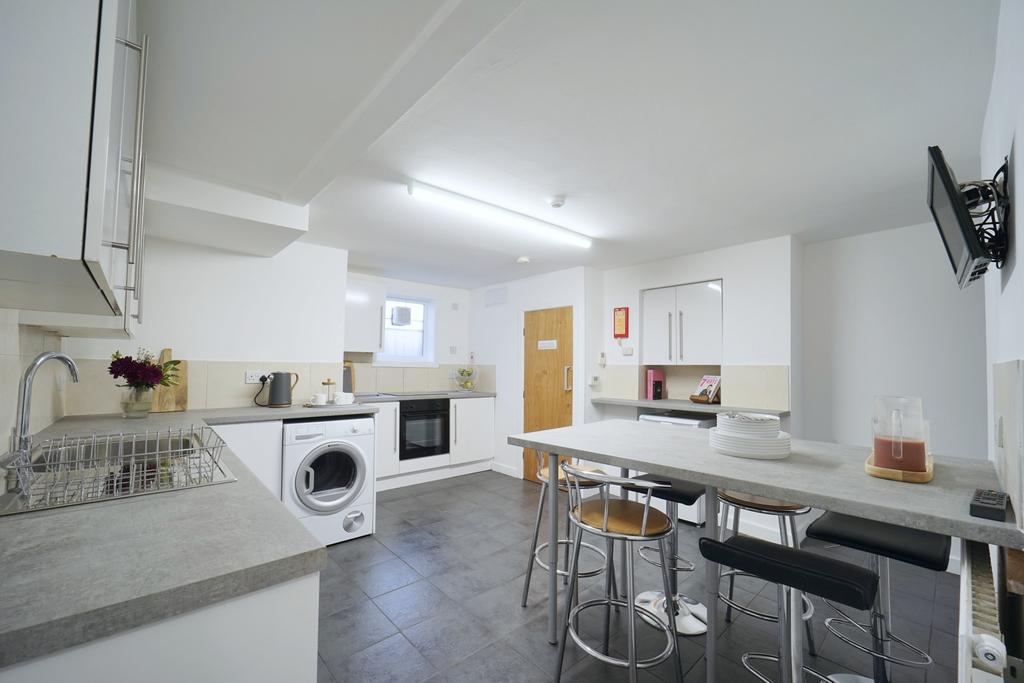 Bright modern kitchen with a large breakfast ba...