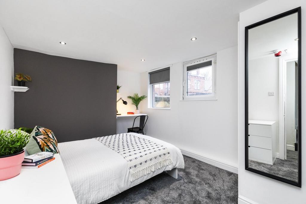 Bright, modern bedroom with a comfortable doubl...
