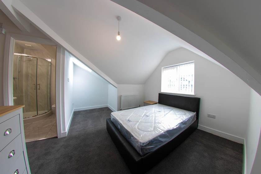 Bright attic double bedroom with pitched ceilin...
