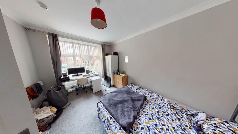 Bright, well-lit double bedroom with a large fr...