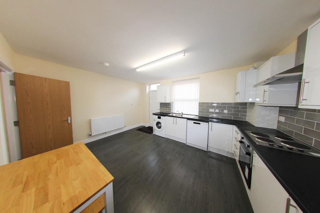 Bright modern kitchen with white fitted units, ...