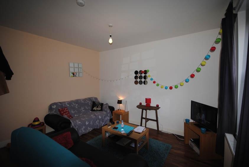 Cozy furnished living room with a sofa, coffee ...