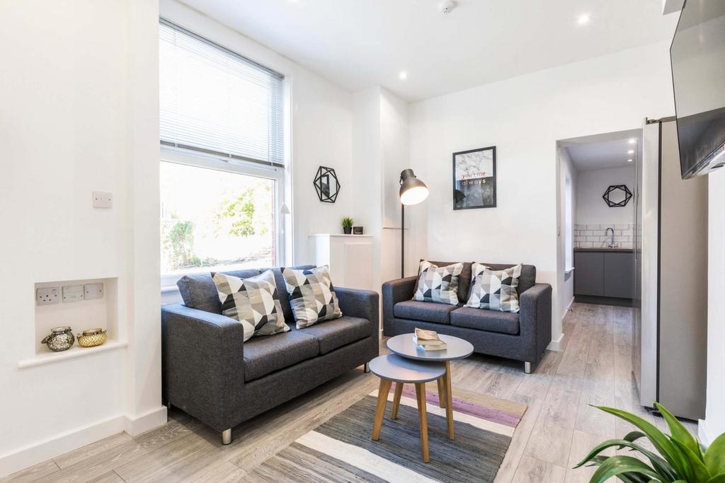 Bright, modern living room with two comfortable...