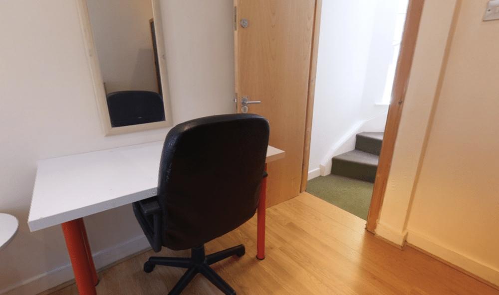 Bright, tidy workspace with a simple white desk...