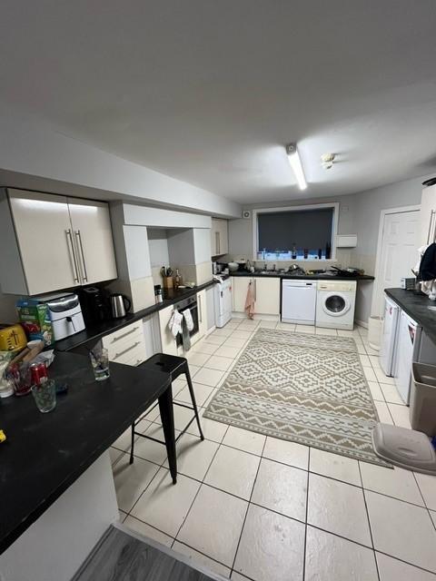 Bright, modern kitchen with plentiful storage, ...