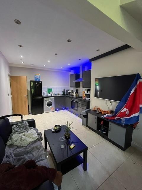 Modern open-plan living area with a fitted kitc...