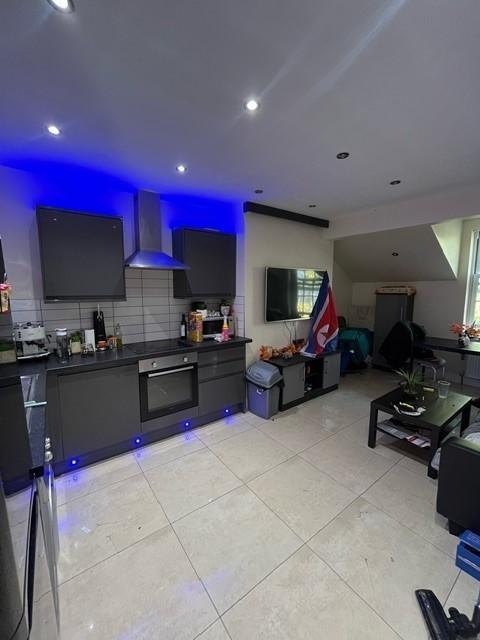 Modern open-plan kitchen and seating area with ...