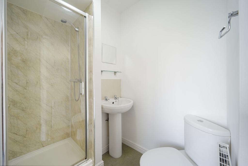 Bright, modern bathroom with a walk-in shower, ...