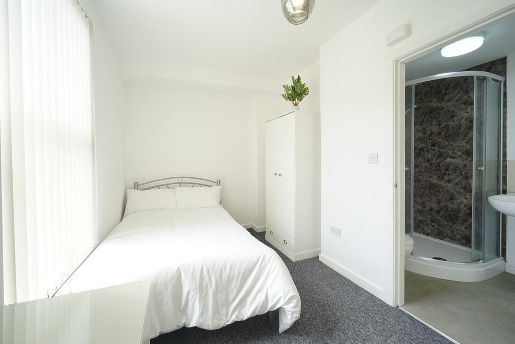 Bright, neatly presented bedroom with a comfort...