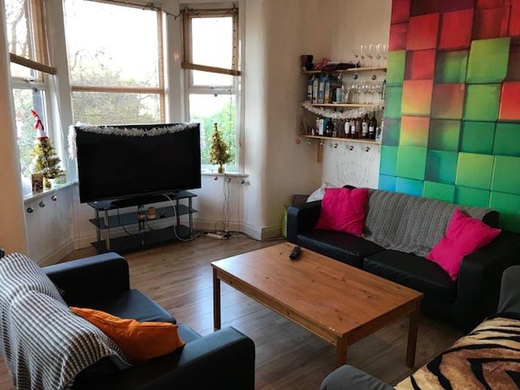 Bright, contemporary living room with a bay win...