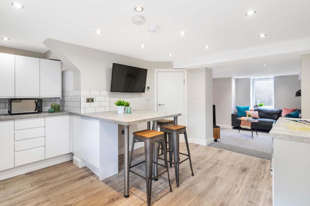 Bright, modern open-plan kitchen and living are...