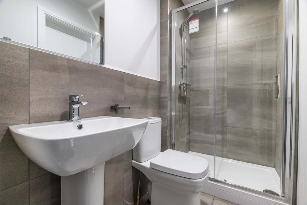Modern, well-maintained bathroom with a large g...