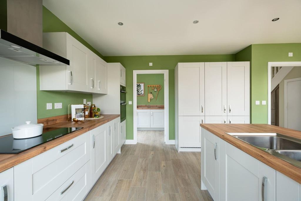 There's a useful utility room off the kitchen,...