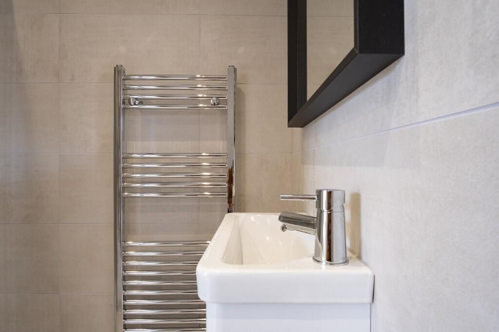 A clean and bright bathroom featuring a modern ...