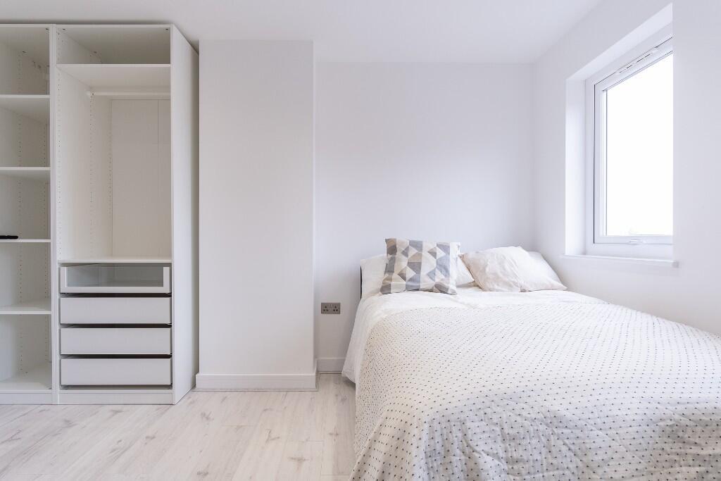 Bright and inviting double bedroom featuring a ...
