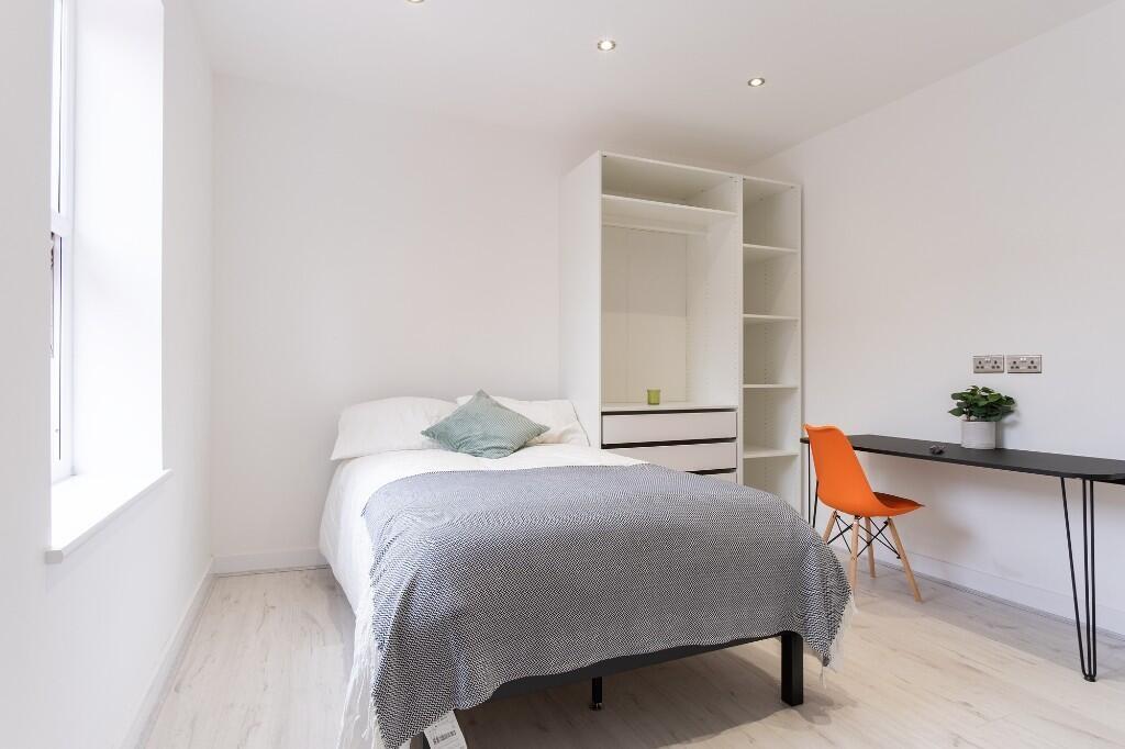 A bright and airy double bedroom featuring a co...