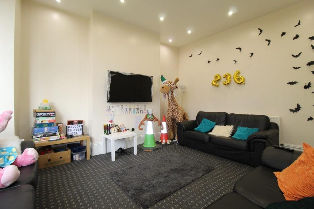 Bright communal lounge with comfortable sofas, ...