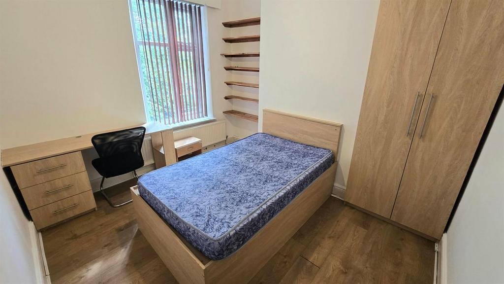 Bright, neatly presented bedroom with a double ...