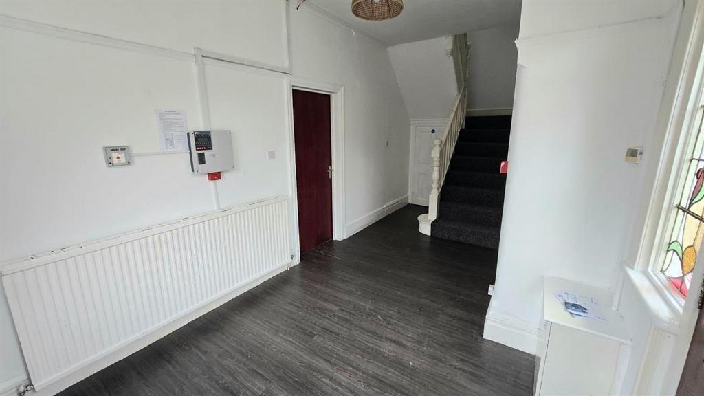 Bright, recently refreshed hallway with dark wo...