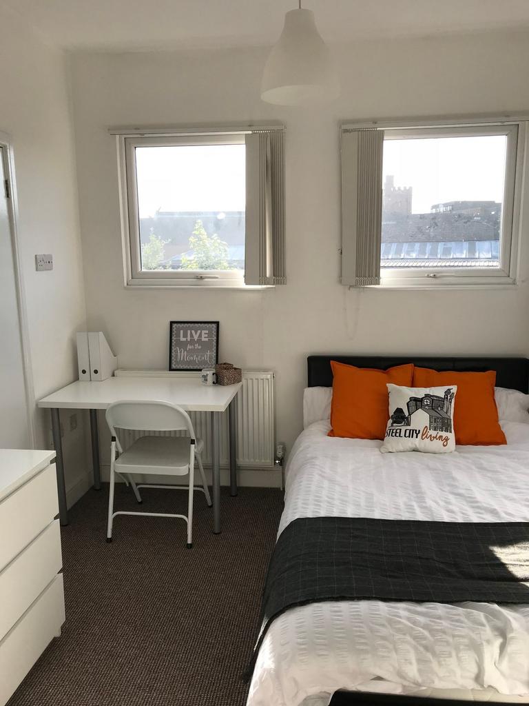 Bright, neatly presented bedroom with a double ...