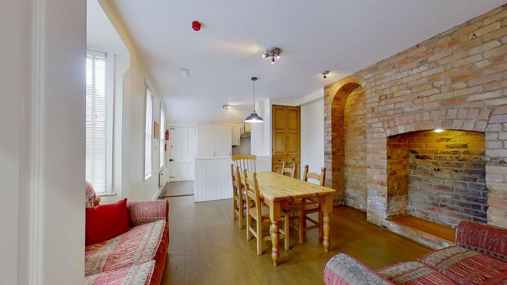 Bright open-plan living and dining area with wo...